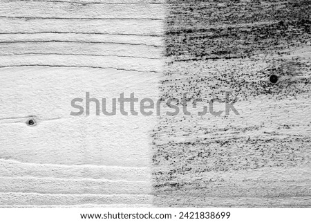 Wood structure, one half of the board is cleaned, the other half of the board is unseen, contrast, clean and dirty, black and white photo
