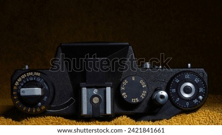 Through the lens: Capturing moments with old vintage mechanical photo camera. The photography of other times, close-up and details.