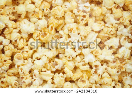 Popcorn, Snacks a background Royalty-Free Stock Photo #242184310