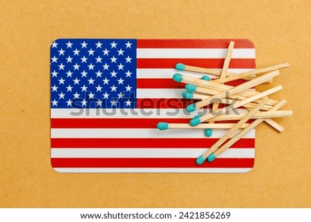 Matches on an American flag background with selective focus and copy space for text