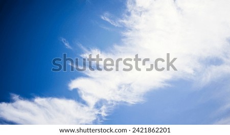 The appearance of beautiful white clouds in the clear blue sky. Clear and beautiful sky for background.