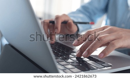 Close up, business woman hand typing on laptop computer, online working at office, searching the information, surfing the internet. work planning, e-learning, online content creation Royalty-Free Stock Photo #2421862673