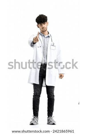 Male doctor, full-length, on a white background, shows a stop sign