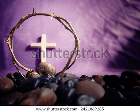 Lent Season,Holy Week and Good Friday Concepts. Crown of thorns in purple background. Stock photo. Royalty-Free Stock Photo #2421869285