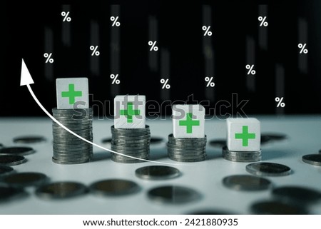 Wooden cube in stacking stair step in dark background with plus icon and up white arrow. Rate rising illustrated by the upward arrow and icon percentage, interest rates going up