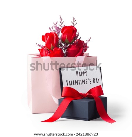 Happy valentines day card on black gift box and rose in paper bag isolated on white background