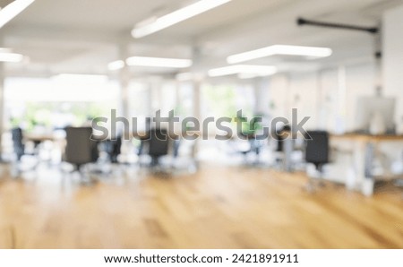 A Modern blur open space employees Workings table full furniture. Still life shot of a modern wide office space.