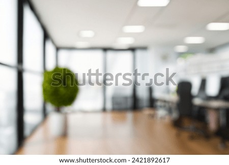 Beautiful blurred background of a modern Industrial office interior in Vintage tone with panoramic windows glass partitions and plywood Wooden floor