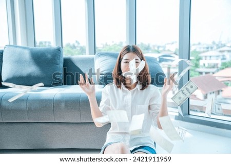 Happy young asian woman holding dollar money and throw in the air celebrate happiness dance wealth lottery money rain drop. Winner Success business woman throw cash flow Happy money smiling face