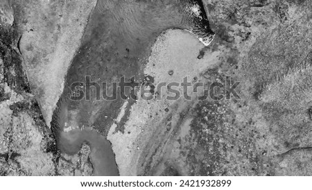 Aerial view of beautiful Stjornarfoss waterfall on a wet rainy day.