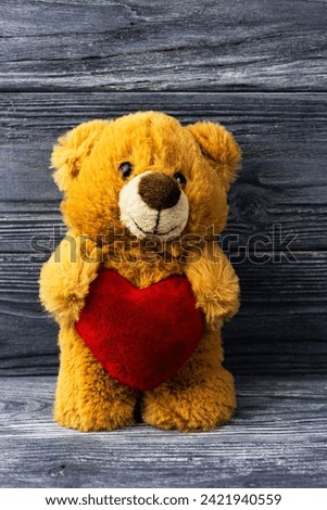 Teddy bear with a heart, vintage tone, concept of love, Valentine's Day holiday. Mothers Day