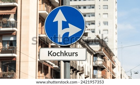 A picture with signposts in the direction of a cooking course in German