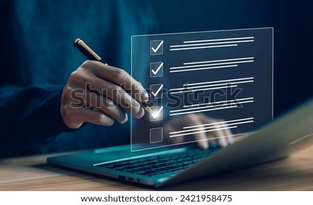 business verify task detail, tick checkmark in the survey item on a laptop. concept of task audit in a list of documents, option check form online, checklist process order, and evaluation tick mark Royalty-Free Stock Photo #2421958475