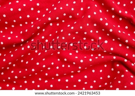 Closeup view of red polka dot fabric texture as background Royalty-Free Stock Photo #2421963453