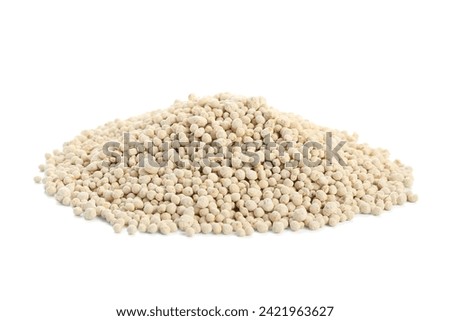 Pile of granular fertilizer isolated on white background Royalty-Free Stock Photo #2421963627