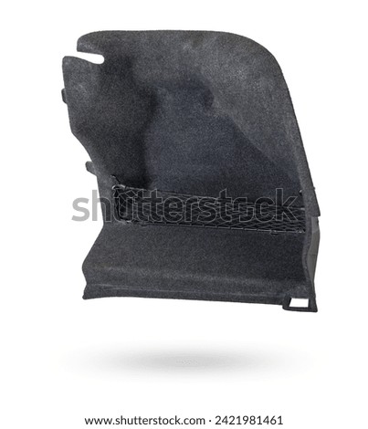 Sheathing of a car body part - trunk made of gray fabric on a white isolated background in a photo studio for replacement or sale in a workshop.