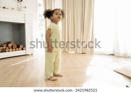 Little African American girl playing freedom at home. the child playing high-quality photo