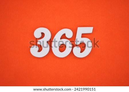 Orange felt is the background. The numbers 365 are made from white painted wood.