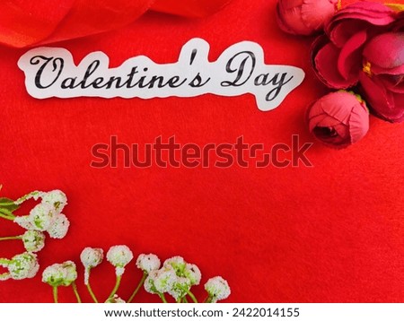 Valentine's Day concept celebration, congratulation. Red greeting Card with flower, Satin ribbon for Background, texture, place for text, copy space