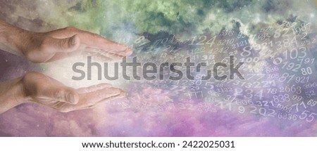 Offering you Numerology expertise concept - male parallel hands with random numbers flowing out against a beautiful celestial sky  background 
 Royalty-Free Stock Photo #2422025031