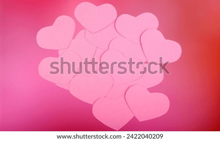 pink flying hearts isolated on pink color background. Paper cut decorations for Valentine's day border or frame design,