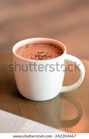 Cup of hot chocolate on the table