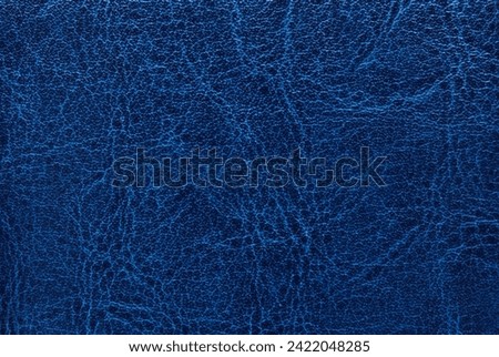 Dark blue leather texture as background