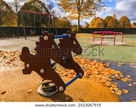 playground spring horse in an autumn playground