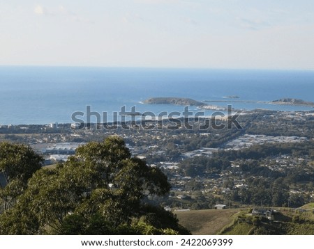 Harborside Haven: Aerial View of Coastal Town and Peninsula Royalty-Free Stock Photo #2422069399
