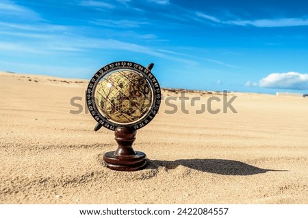 Conceptual Photo Picture of a Globe Earth Object in the Dry Desert