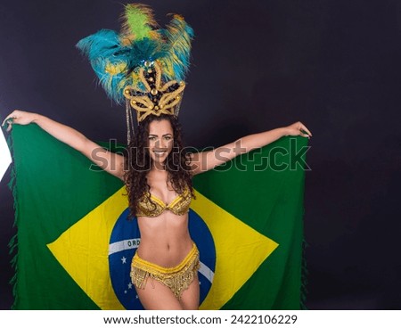 Brazilian afro woman posing in samba costume on black background with the flag of Brazil
