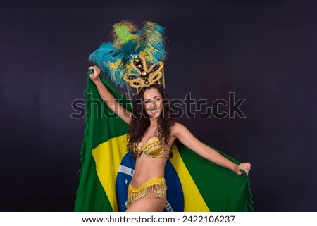 Brazilian afro woman posing in samba costume on black background with the flag of Brazil