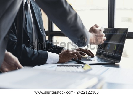 Business people meeting discuss project plan and finance results in office. Businessman financial advisor analyzing the financial data graph and charts on the laptop computer screen.