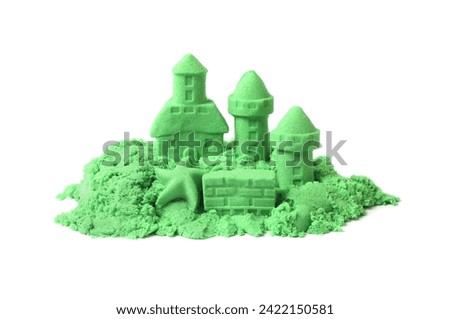 Castle figures and starfish made of green kinetic sand isolated on white Royalty-Free Stock Photo #2422150581