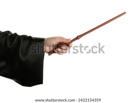 Wizard holding magic wand on white background, closeup Royalty-Free Stock Photo #2422154359