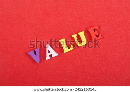 Word on red background composed from colorful abc alphabet block wooden letters, copy space for ad text. Learning english concept