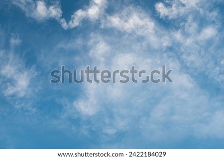 Sky background for celebration and season decoration. Light blue sky with white clouds for publication, design, poster, calendar, post, screensaver, wallpaper, cover, website. High quality photography