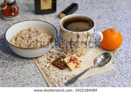 Oatmeal And Coffee. Traditional Breakfast. Breakfast From Oatmeal With And Cup Of Black Coffee On A Table. Not Stock Photography.