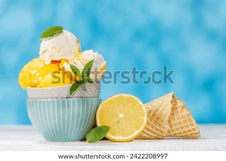 Refreshing ice cream scoops treats with a hint of zesty lemon flavour and waffle cones