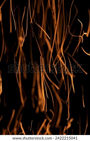 Sparks Fly On A Long Shutter Speed Black Background