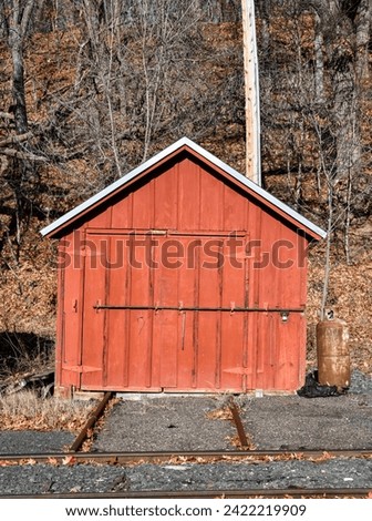 small red railway wooden shed Royalty-Free Stock Photo #2422219909
