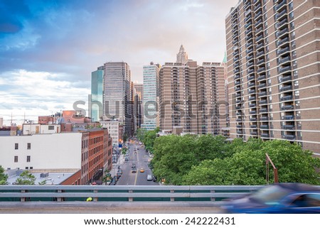 Cars speeding up in Lower Manhattan, New York City.