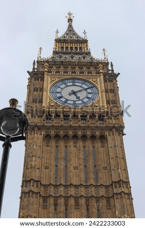Close up view of the Elizabeth Tower is the clock tower of the Palace of Westminster in London, Big Ben on a cloudy day. Westminster underground station.