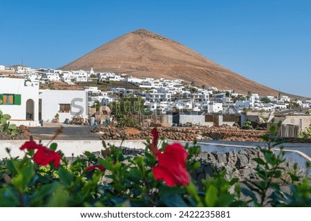 Charming view of Tias village against the iconic Montaña Blanca in Lanzarote, capturing the essence of Canarian life and volcanic landscapes. Royalty-Free Stock Photo #2422235881