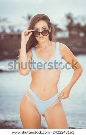 girl in bikini with a pamela on the beach
