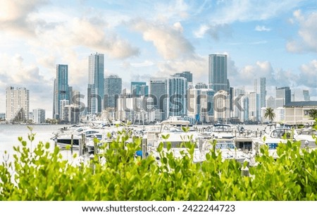Miami Downtown skyline in daytime with Biscayne Bay and yachts