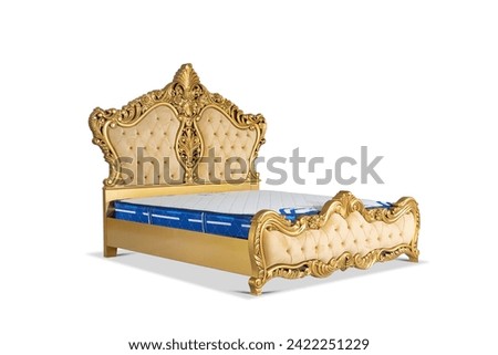 golden furniture details. Big comfortable double royal bed in white background