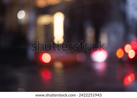 Blurred lights of the evening city. Blurred background with bokeh.