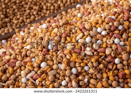 Fresh mixed nuts (hazelnuts, peanuts, roasted chickpeas, sunflower seeds, almonds, pistachios, etc.) sold openly in the market,