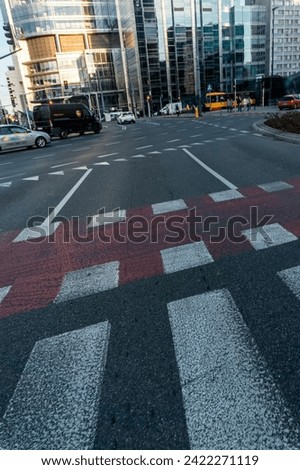 pedestrian crosswalk on road at downtown district of big city, street view